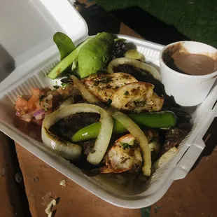 a takeout container of food