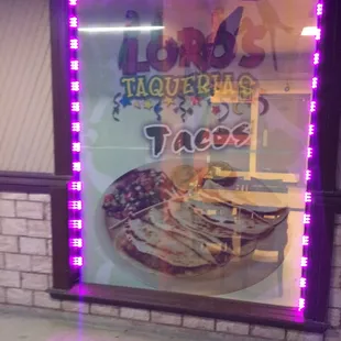 a window display of a taqueria