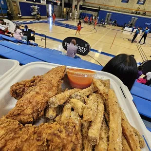 a tray of fried fish and fries
