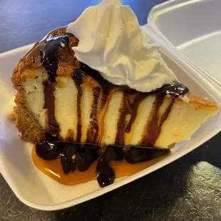 Cheese cake with turtle topping. I was so stuffed I had to get it to go but I took a bite and it was so delicious. This is a game changer!