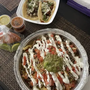 Carne Asada Fries. One taco of lengua(beef tongue) and another taco of tripitas(cow's small intestine).