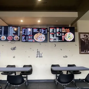 two tables and a menu board