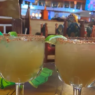 two margaritas on a table