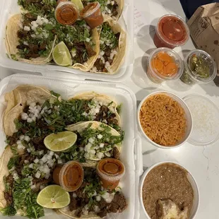 10 street tacos. 5-in one box, 5-in the other, Rice and beans, jalapeños and carrots, hot sauce and salsa