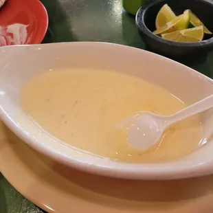 a bowl of soup with a spoon in it