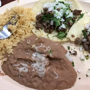 Taco, refried beans, and rice.