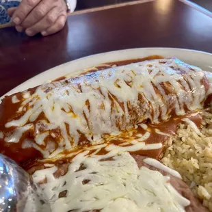 Huge shredded beef chimichanga enchilada style, with red sauce. So delicious!!