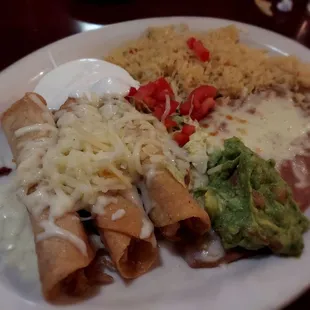 Chicken flautas with rice and beans