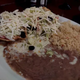 Two chicken tostadas with rice and beans