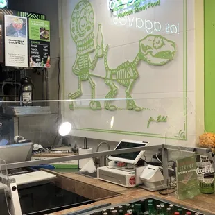 a kitchen with a neon sign