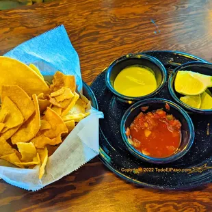 a plate of chips and salsa