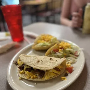 Puffy tacos, chorizo and egg taco