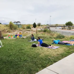 a group of people doing yoga
