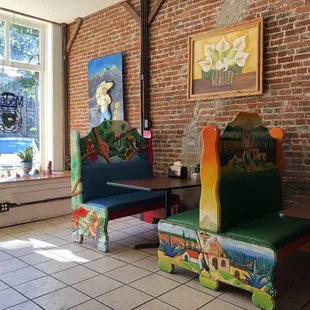 a colorful bench and chairs