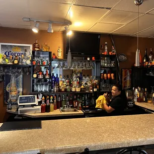 a woman behind the bar