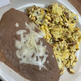 Machaca eggs! Dried beef  with scrambled eggs. Very traditional meal. If you wanna go the next level on this meal, have them add pico!