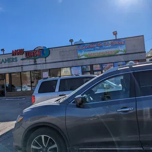 a car parked in front of a restaurant