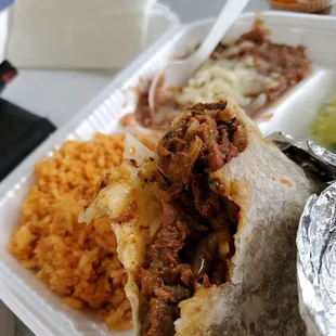 All meat al pastor burrito, side of rice and beans
