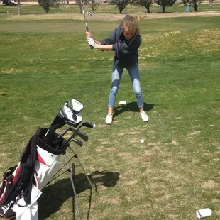 Carly loves to play golf
