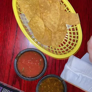 a basket of chips and salsa