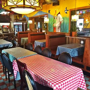 tables and booths with checkered tablecloths