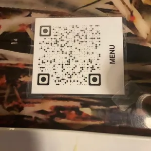 a qr code on a piece of pizza