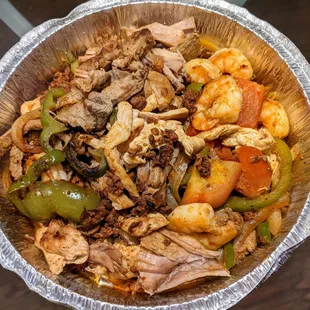 The parrillada includes beef, chicken, shrimp and pork, as well as rice/bean. Some of the meat was well prepared, some was overdone.