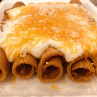 Beef rolled tacos; cheese &amp; sour cream only