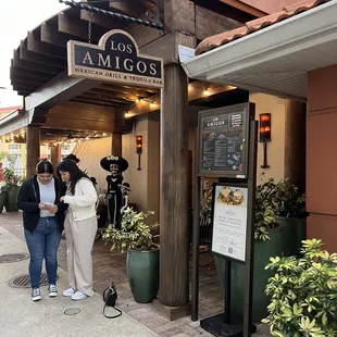 two people standing outside