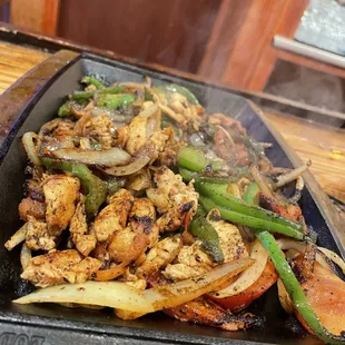 chicken and vegetables on a grill