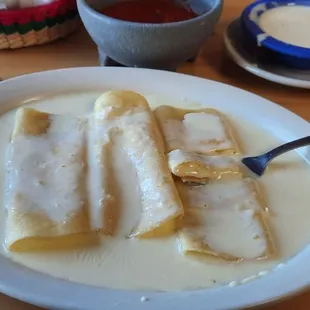 Cheese enchiladas with queso.