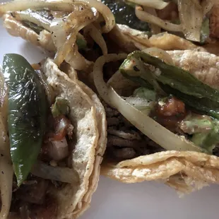 Traditional tacos, without onion and cilantro. Added a grilled onion and jalapeño
