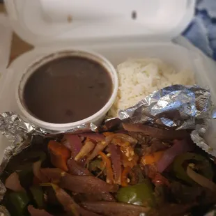 Lomos Saltados with rice and beans