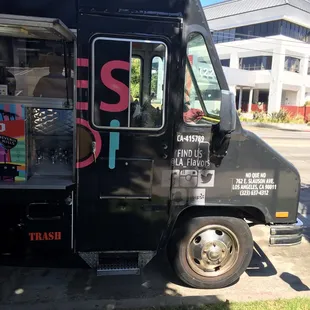 a food truck parked on the side of the road