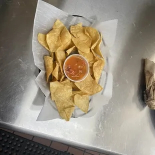 a plate of chips and salsa