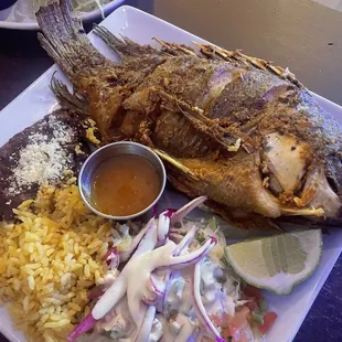 Whole Pescado w/rice, refried beans, cabbage salad