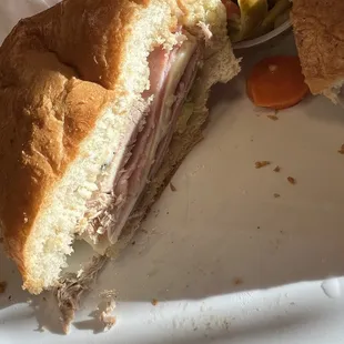 a half eaten sandwich on a plate