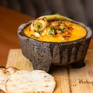 a bowl of soup and bread