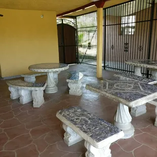 a stone table and benches