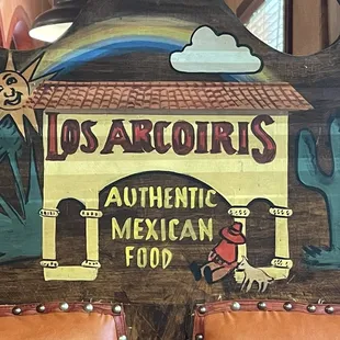 Restaurant logo on the booth.