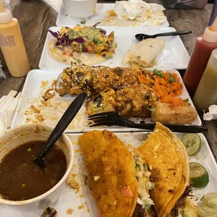 Quesebirria tacos, shrimp tacos, and sushi