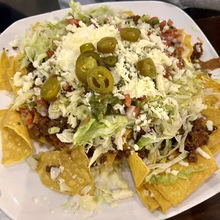 She liked her nachos but I recommend they use thicker chips because it's same chips as table and you get bored