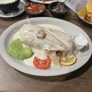 Seafood Chimichanga with sour cream on the side