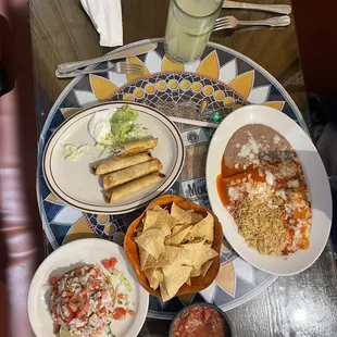Ceviche tostada, Taquitos and Enchilada plate
