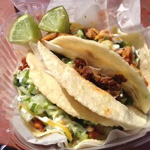 Al pastor, steak, and chicken tacos.