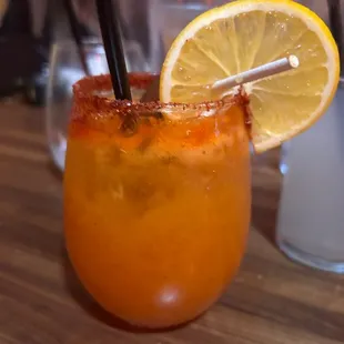 a drink with a slice of lemon