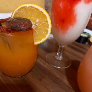 a close up of two cocktails