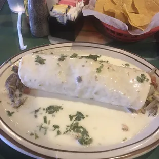 Carnitas Burrito off the lunch menu...yum but after chips I could only finish half