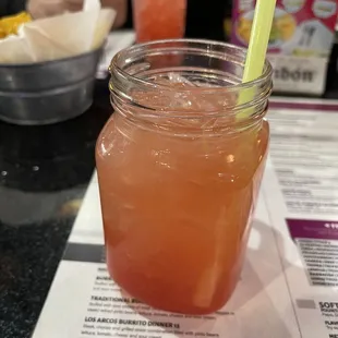 a drink in a mason jar on a table