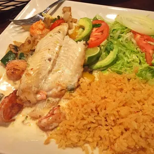 The Chef's Special. (Jumbo shrimp, white fish on a bed of rice with avocado salad and cheese)